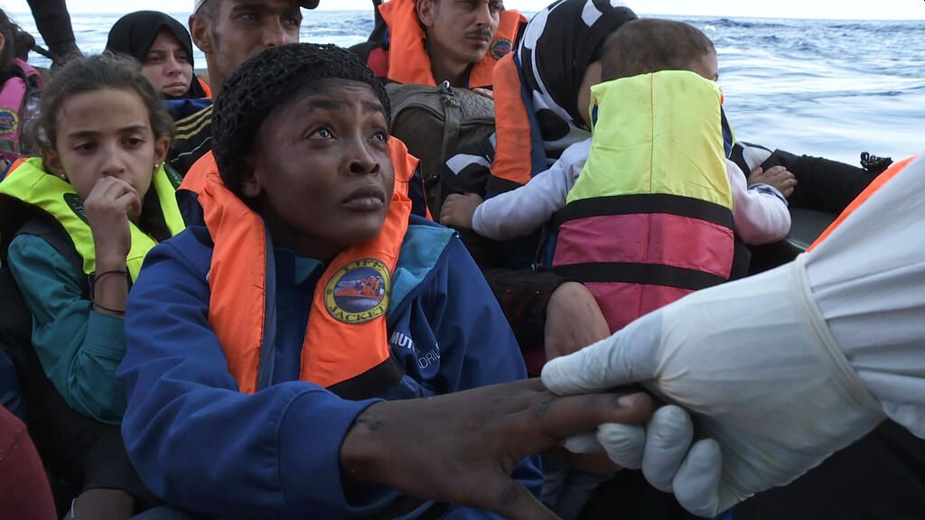image of refugees in boat
